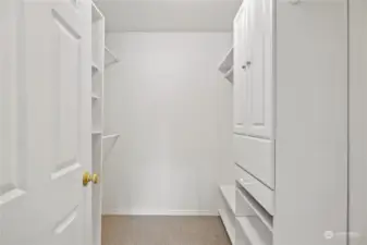 The Primary Suite walk in closet. Ideally outfitted for storage and organization