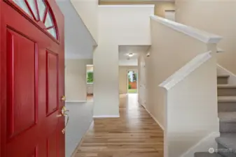 Upon entry, sense the flow and warm glow of recently refreshed hardwood flooring