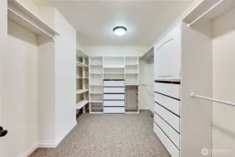 The closet in the primary bedroom is huge! Built-in drawers, shelving and lots of hanging space.
