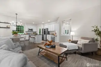 Additional cabinetry is built around the refrigerator, along with a desk area for remote work if needed.