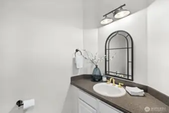 A powder room on the main floor is conveniently located off the foyer and great room.