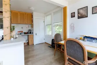 Eating space facing stairs to basement.