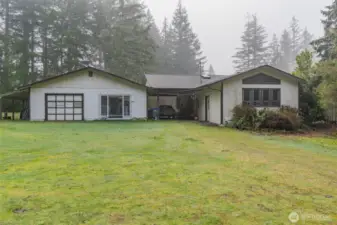 House with Carport in between and Garage/Shop # 1 with Apartment
