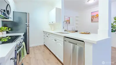 Updated kitchen in 2025 with quartz countertops and LPV flooring.