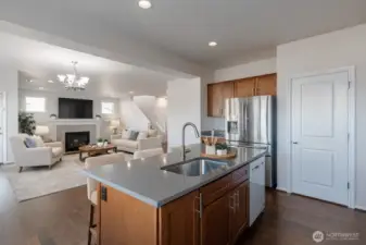 Virtually staged. Open sightlines enhance connectivity between rooms.