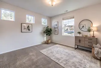 Bright secondary bedroom with flexible layout and an adjacent 3/4 bath on the main level.