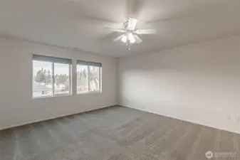 Another view of the primary bedroom. Calm, neutral tones create a serene retreat.