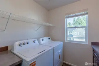 Convenient upper level laundry room.