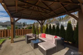 Covered pergola in the backyard is perfect for relaxing or entertaining.