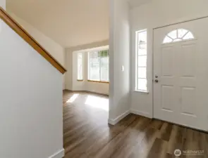 Front door looking towrds Living Room. Fresh interior Paint and new LVP flooring and carpet through-out.
