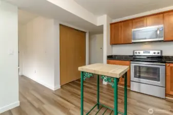 Kitchen has room for a bigger island or table/ chairs. Fresh interior Paint and new LVP flooring and carpet through-out. Large Shelved pantry.