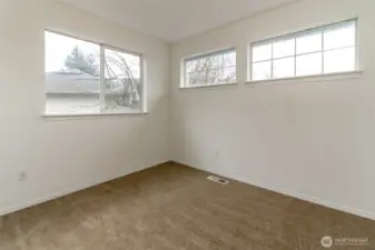 One of the upstairs bedrooms with generous closet space not pictured. Fresh interior Paint and new  carpet through-out.