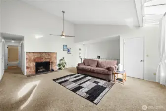 Open concept layout with vaulted ceilings.