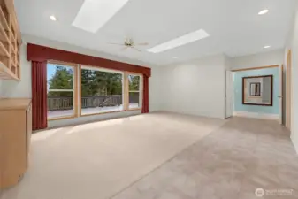 Living room with the double door entry into master suite where you see the mirror on the wall.