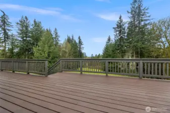 Spacious deck with partial Sound view. Plenrty of room for outdoor dining and entertaining.Stairs down to your nearly 6 acres.