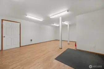 Extra finished "bonus room" downstairs off the MIL unit....approx 300 sq ft which is not included in the 3906 sq ft Could be an office or exercise room, or justn use for additional storage..