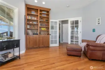 Custom built in shelving in the expansive office.