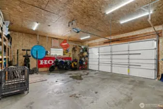 Finished garage with built in storage and built in work bench