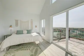 Primary suite and view of deck.