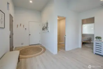 Another view of entry area with front door on the left and door to attached garage.