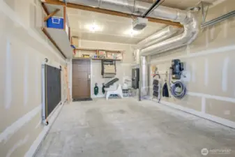 Attached garage with door to back yard and door to house.