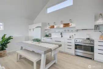 Dining area and kitchen with plenty of storage for all your cookware and kitchen staples.