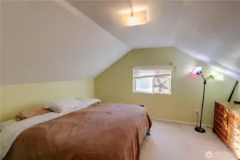 The third bedroom, on the upper level, used as the Primary Bedroom.