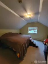 The third bedroom, on the upper level, used as the Primary Bedroom.