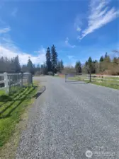 Three home gated community at the end of a long dead end road .... but just two miles west of I-5. No thru traffic.