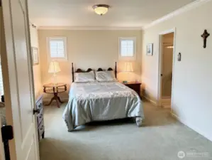 The primary bedroom with ensuite bath and walk-in closet.