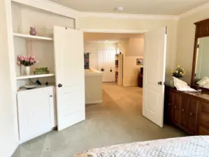 The primary bedroom includes double doors and built-in casework.