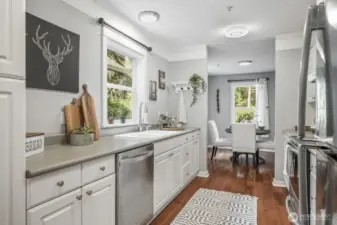 The kitchen features sleek stainless steel appliances, offering both modern style and high-end functionality for everyday cooking and entertaining.