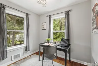 The third bedroom offers flexible space, perfect for use as a den or home office.