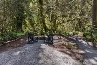 A private trail winds through the natural landscape, leading to the tranquil creek.