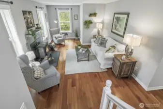 Rich cherry hardwood floors flow through most of the main living space, adding warmth and character.