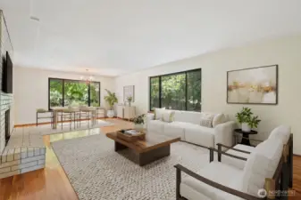 Large living room with picture windows to private backyard - gleaming original hardwood floors. Virtually staged to show potential of this space!