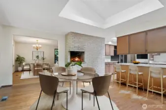 Kitchen eating area with views toward the kitchen and dining area. Slider to left leads to patio and private backyard. Nice bright large skylight offers a lot of natural light! Virtually staged to show potential of this space!