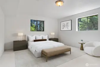 Lower level bedroom with 3/4 bathroom off the hall just outside the door. Currently concrete floor - Virtually staged to show potential of this space!