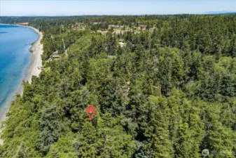 5 acres include waterfront, a cleared space with shingled beach cabin, and plenty of woods to explore or let your imagination decide!