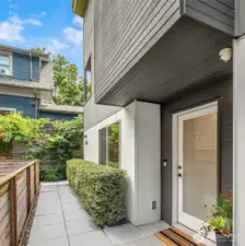 Tucked behind 61st and down a verdant walkway, you will find unit A. One of only two units.