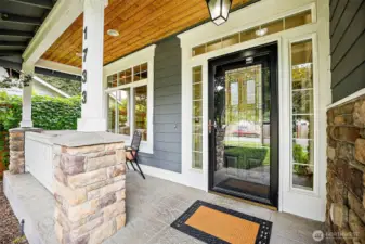 Covered front patio perfect for bistro set to enjoy morning coffee or evening talks with neighbors.