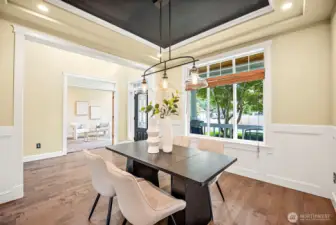 Formal dining room with Industrial black metal with clear glass for a modern classic look.