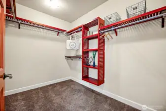 Primary bedroom walk-in closet