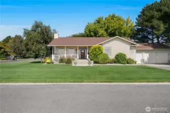 Beautifully landscaped front yard welcomes you home in Ephrata.