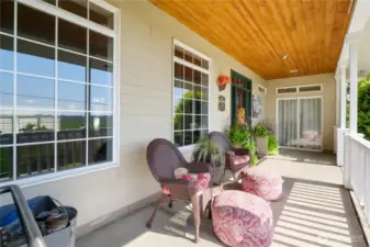 Relax on the spacious front patio overlooking landscaped grounds