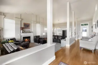 Grand entryway with soaring ceilings and hardwood flooring