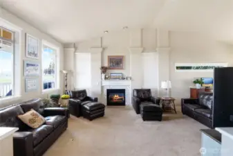 Cozy propane fireplace with tile surround anchors the living space