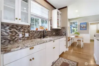 Gourmet kitchen featuring granite countertops and custom cabinetry