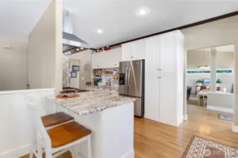 Granite surfaces and elegant finishes throughout the kitchen