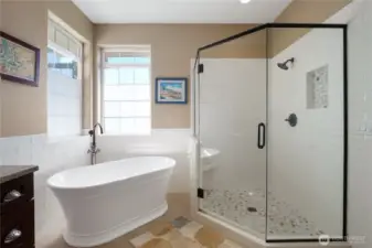 Walk-in tile shower with premium finishes in primary bath